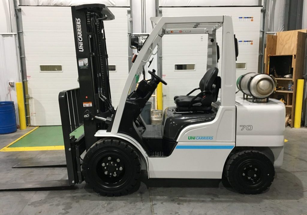 A new Unicarrier 7,000-pound forklift sits near a dock in a warehouse